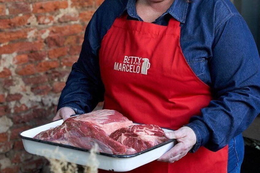 You will have a front-row seat with a direct view of the grill, where you can see how the asado is prepared from raw until it is served on your plate. 2
