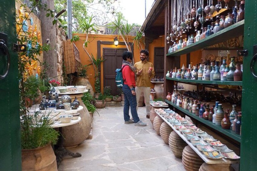 A shop with pottery and ceramics on display. 2