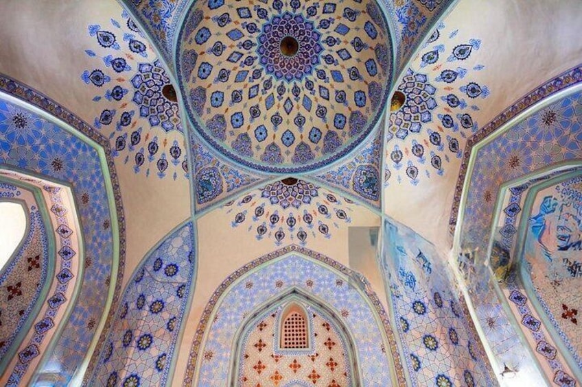 A domed ceiling with intricate geometric patterns and a central opening. 2