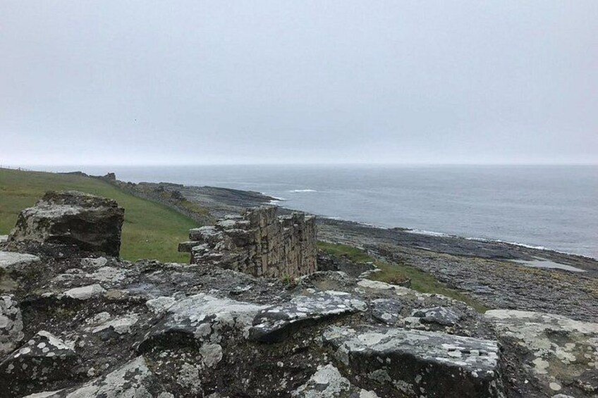 A coastal ruin with a view of the ocean. 2