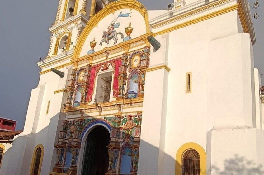 A church with ornate architecture, a bell tower, and a large arched entrance. 3