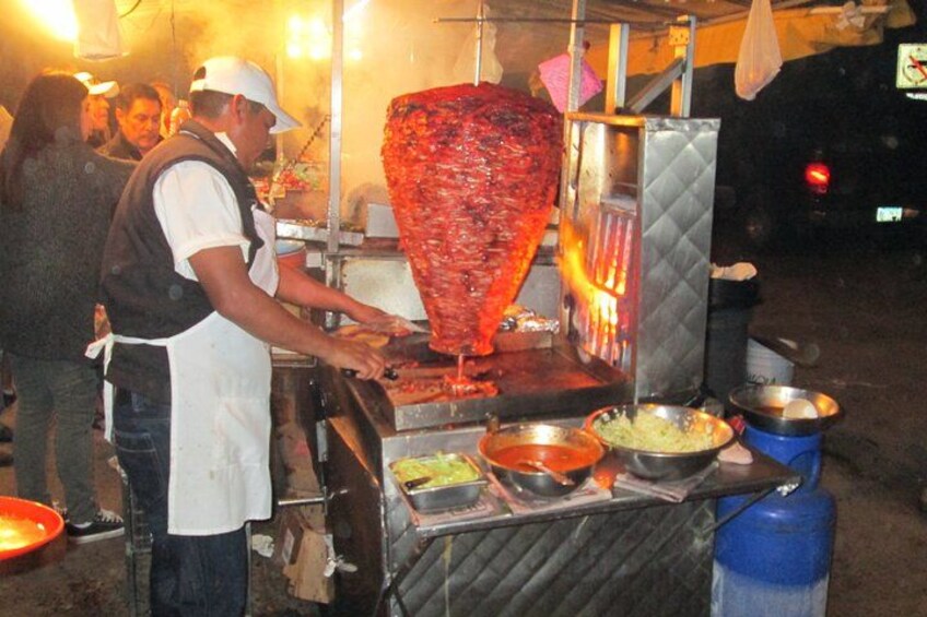 Street food at its best with al pastor tacos. 1