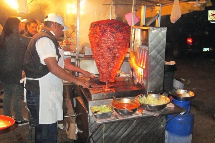 Street food at its best with al pastor tacos. 3