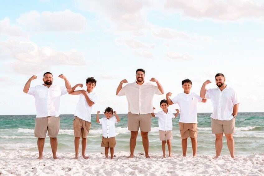 A group of people on a beach with the ocean in the background. 2