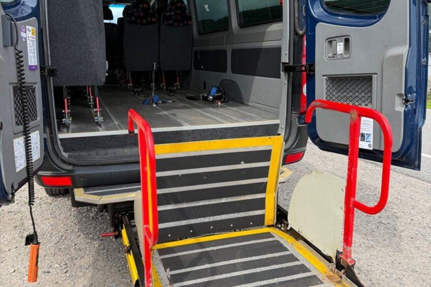 A van with a ramp and steps for accessibility. 4