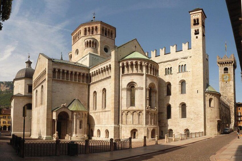 A historic building with a prominent tower, arched windows, and a dome. 2