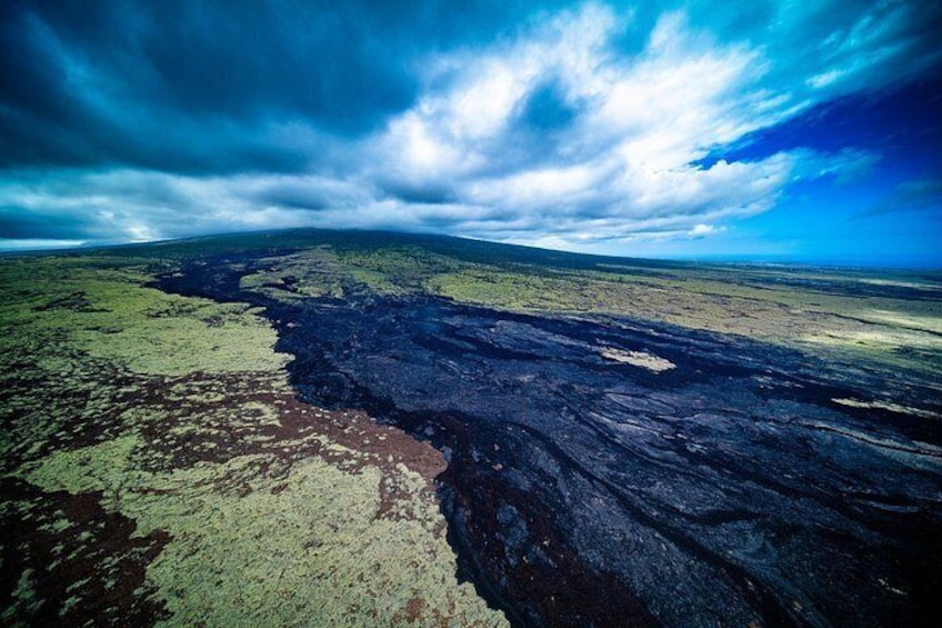 The majestic peak of the Hualālai Volcano rises above the landscape 5