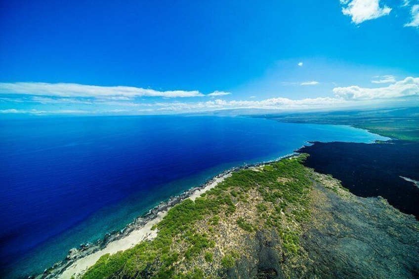 The crystal-clear waters and stunning shores of Kiholo Bay, adorned by Hualālai's ancient lava flow 5