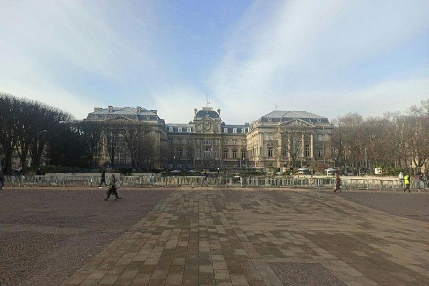 A large open plaza with a historic building in the background. 3