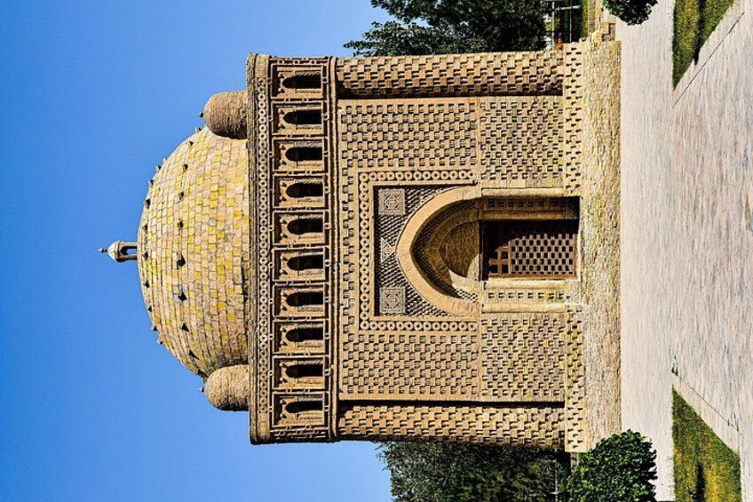 A large, ornate building with a golden dome and intricate brickwork. 5