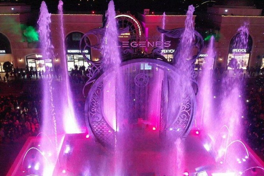 A fountain with water jets and a circular decorative structure. 5