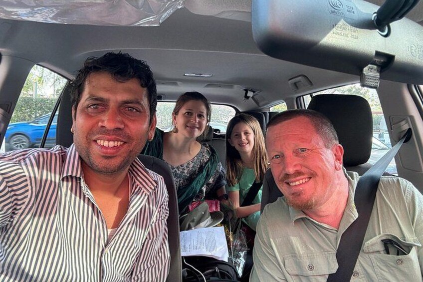 A car interior with four people seated. 3