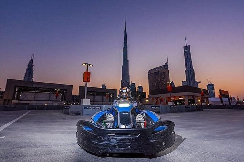 A futuristic vehicle in an urban setting with tall buildings in the background. 4