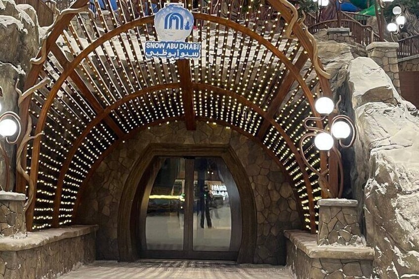 A snow-themed entrance with a sign reading "Snow Abu Dhabi". 5