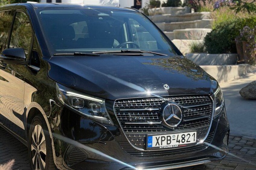 A black SUV parked on a paved surface with a license plate reading 'XPB-4821'. 4