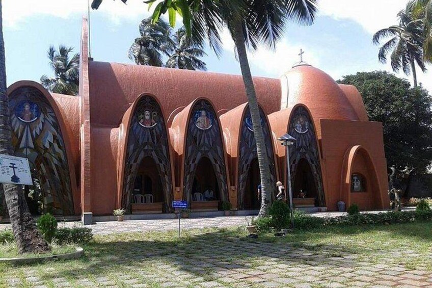 A church with a distinctive red dome and arched windows. 5