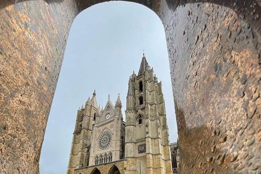 A cathedral with two tall towers and a large circular window. 1
