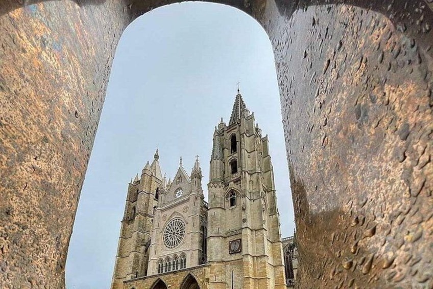 A cathedral with two tall towers and a large circular window. 1