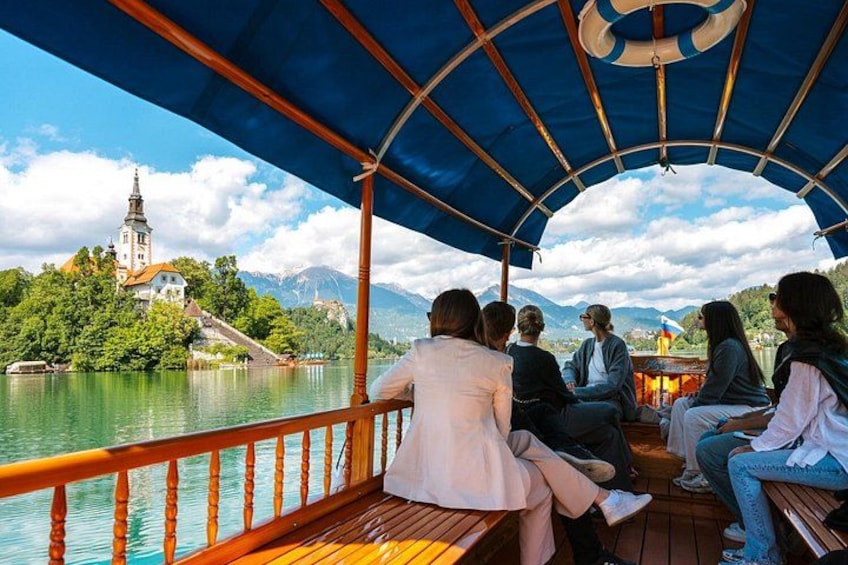 Tourists enjoy a peaceful ride on traditional pletna boats across the crystal-clear
waters of Lake Bled, one of Slovenia’s top travel destinations. 5