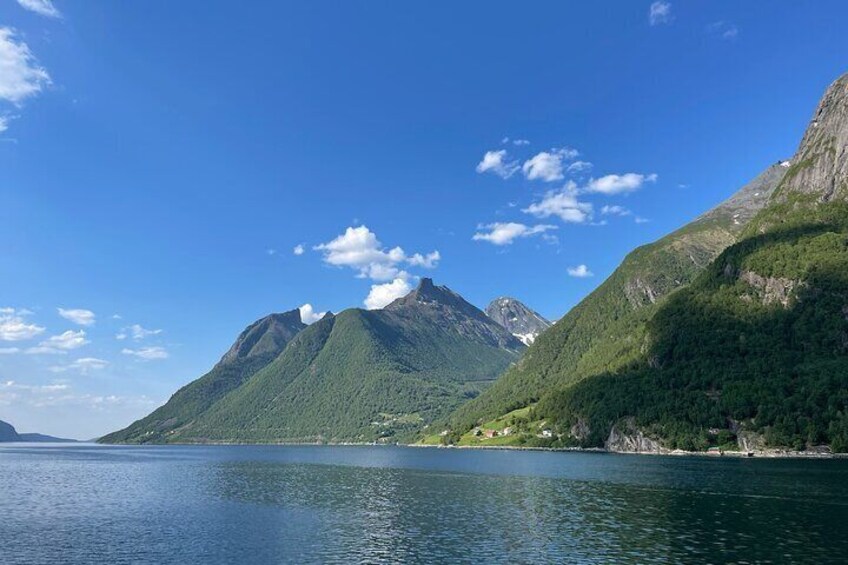 A calm lake with mountains in the background. 5