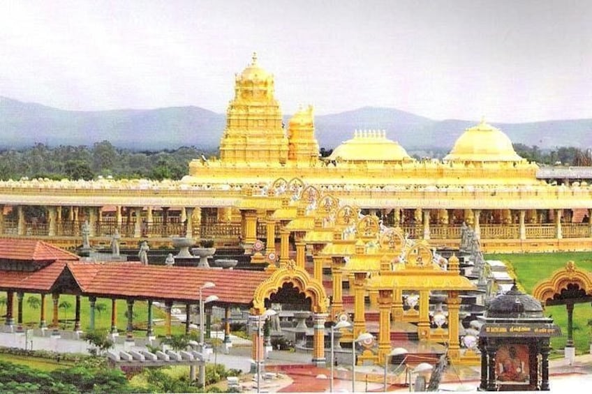 A large, golden temple complex with multiple domes and intricate architecture. 1