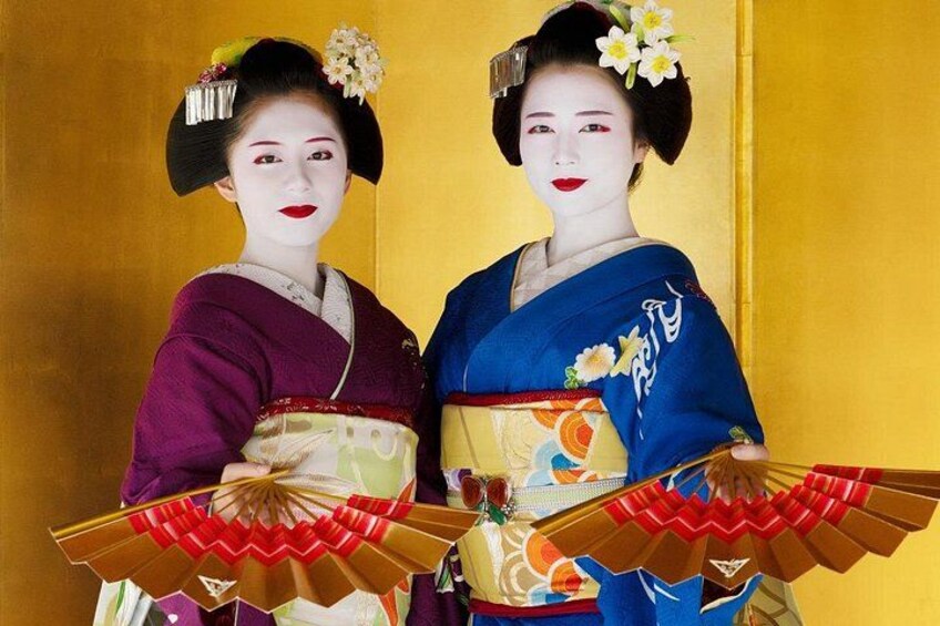 Two individuals in traditional Japanese attire with fans. 5