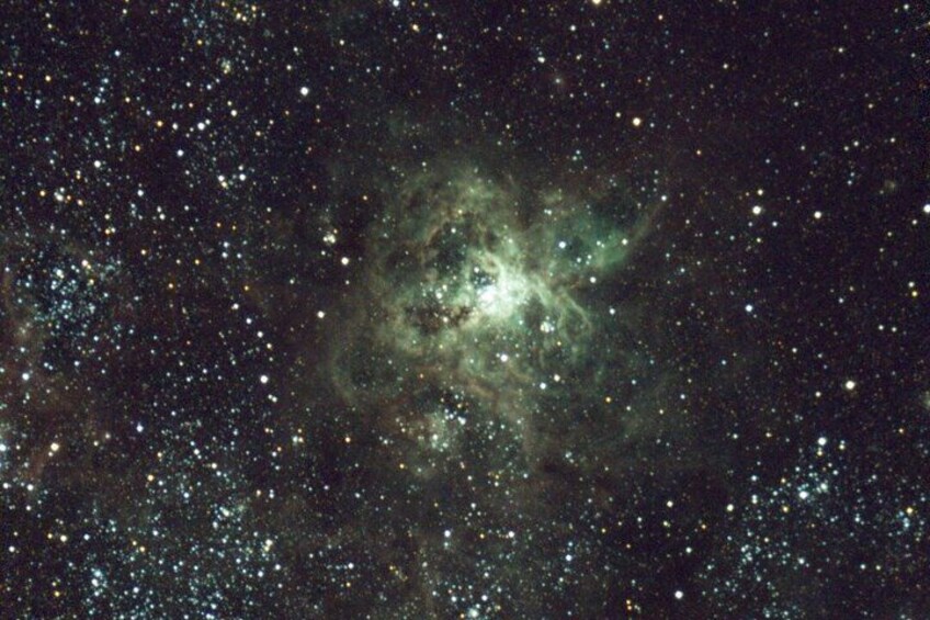 A starry night sky with a nebula. 3