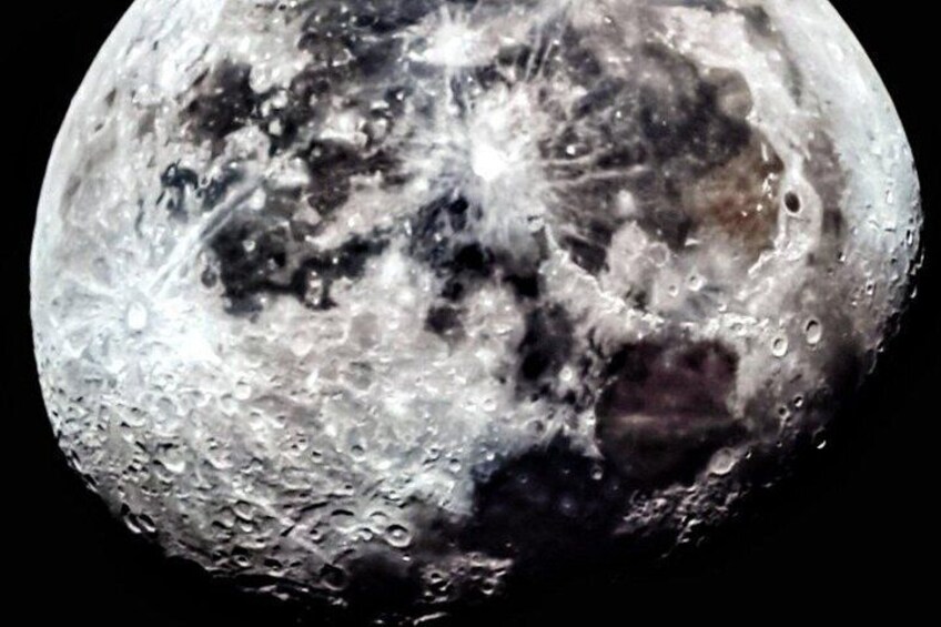 A close-up of the moon's surface with craters and rough terrain. 4