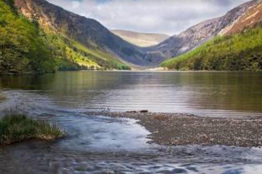 A river flowing through a valley with mountains on either side. 4