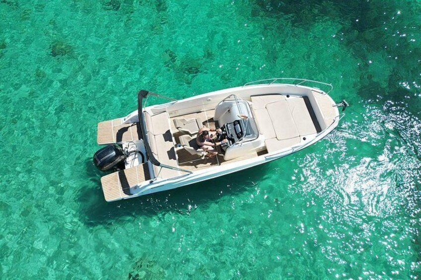 A boat on clear turquoise water. 5