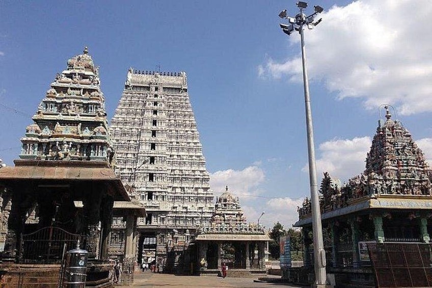 A temple complex with tiered towers and a tall, slender spire. 3