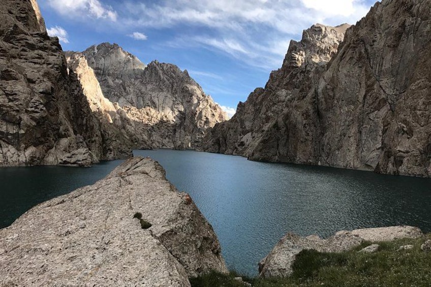 A mountain lake surrounded by rocky cliffs. 3