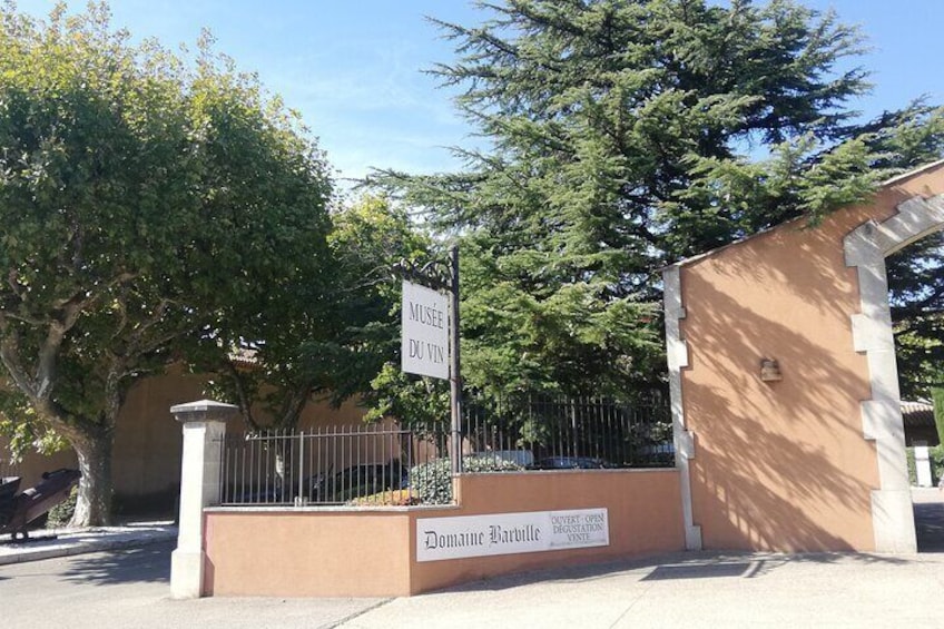 A museum entrance with a sign reading 'MUSEE DU VIN' and a plaque that says 'Domènech Marrulles'. 4