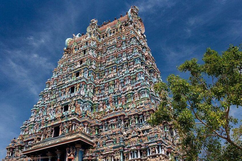 A multi-tiered temple with intricate carvings and multiple spires. 1