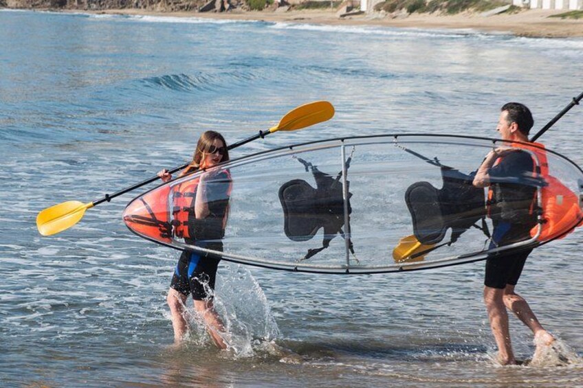 Two people in a kayak on a body of water with waves. 5