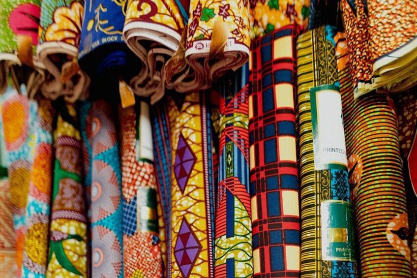 A variety of colorful fabrics with intricate patterns and designs. 4