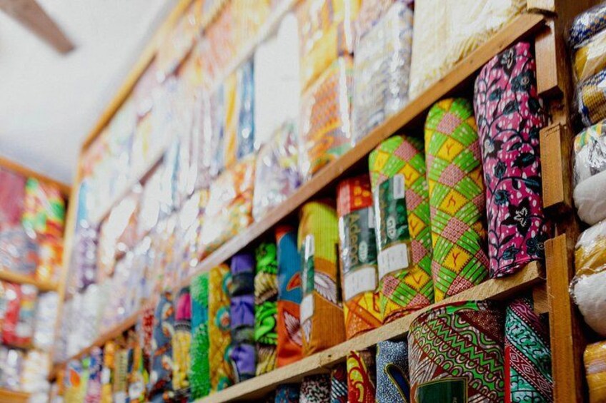 A store with shelves of colorful ties. 1