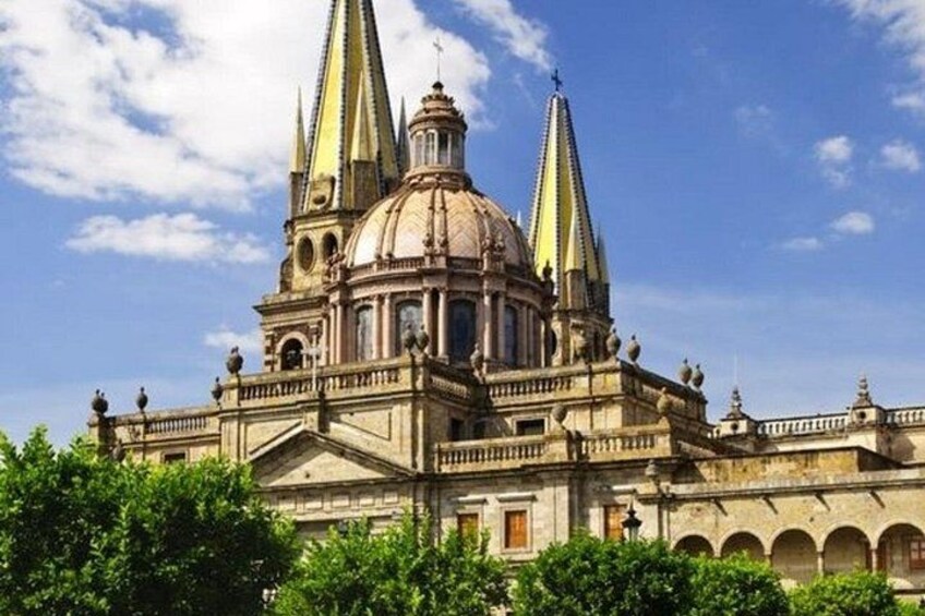 A historic building with a large dome and two tall spires. 5