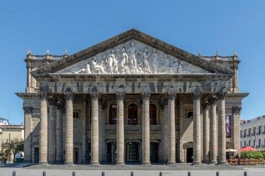 A classical building with columns and a detailed frieze. 3