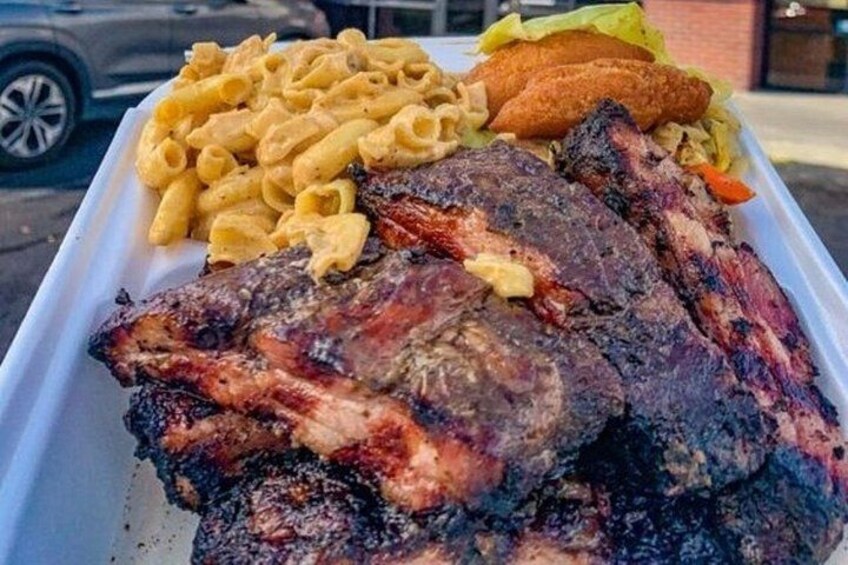 A meal with grilled meat, macaroni, and vegetables. 5