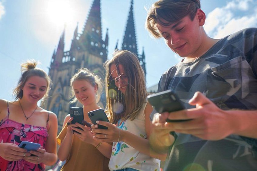 A group of people using smartphones, with a gothic-style building in the background. 1