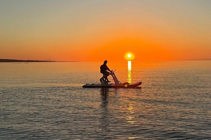 A person paddling a boat during sunset. 3