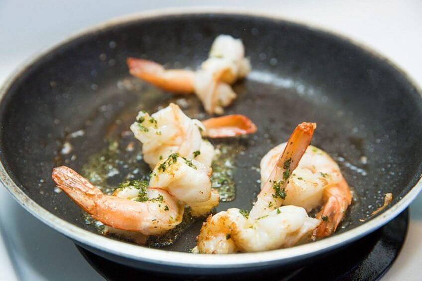 A pan with cooked shrimp. 2