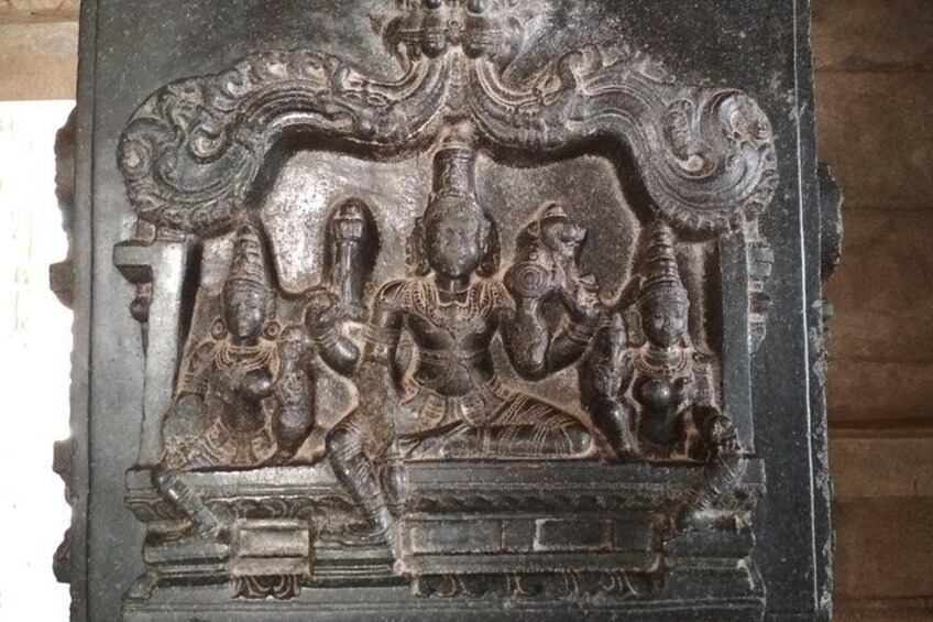 A stone carving with intricate designs and figures. 4