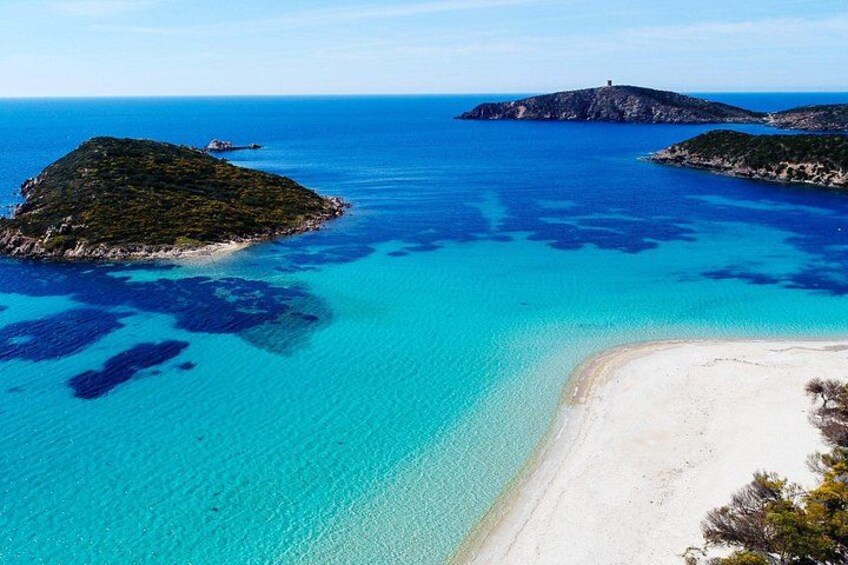 A coastal landscape with clear turquoise waters, sandy beaches, and small islands. 3