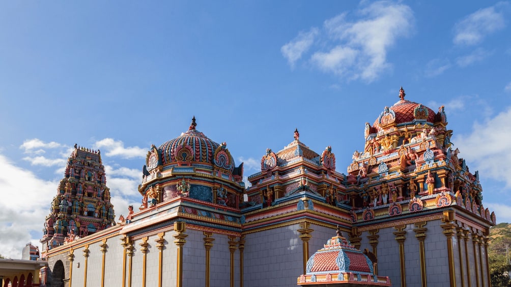 A temple with multiple domes and intricate carvings. 1