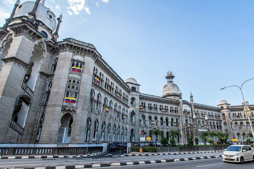 A large, ornate building with multiple domes and flags. 5
