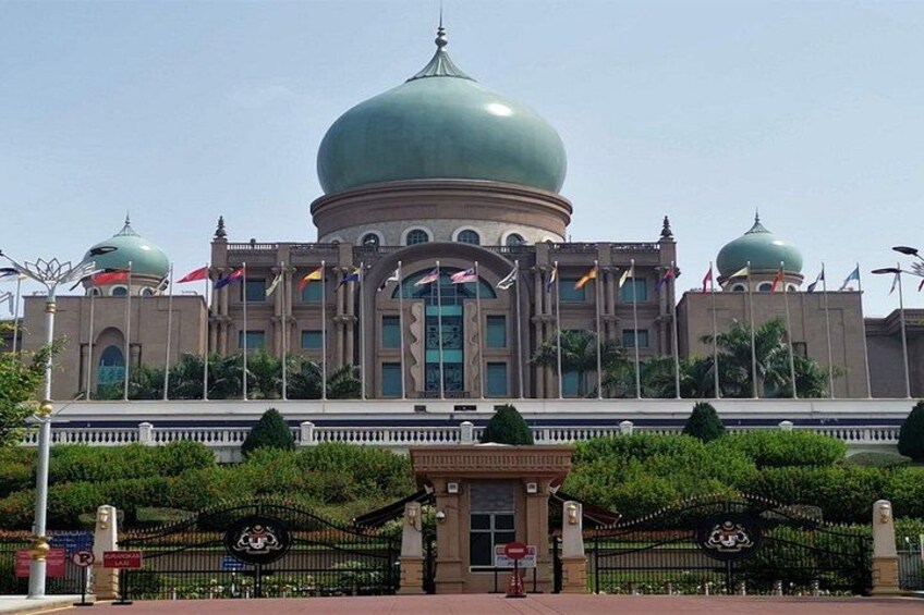A large building with multiple domes and flags. 3