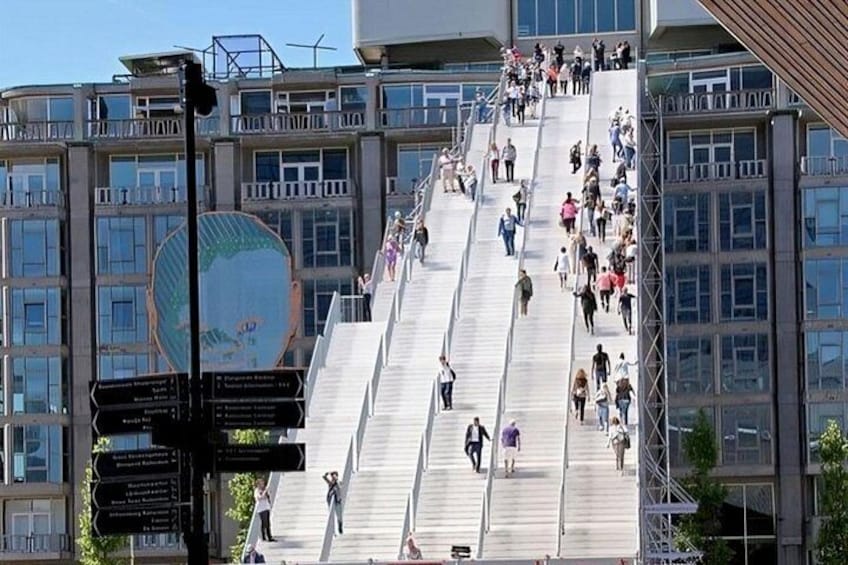 A large outdoor staircase with people ascending and descending. 3
