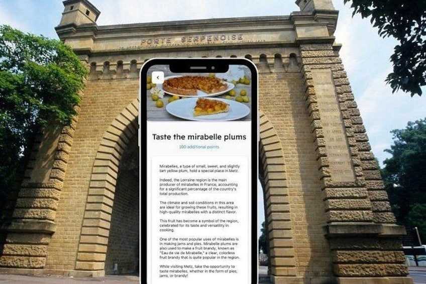 A smartphone displaying text about mirabelle plums in front of a historical building. 3